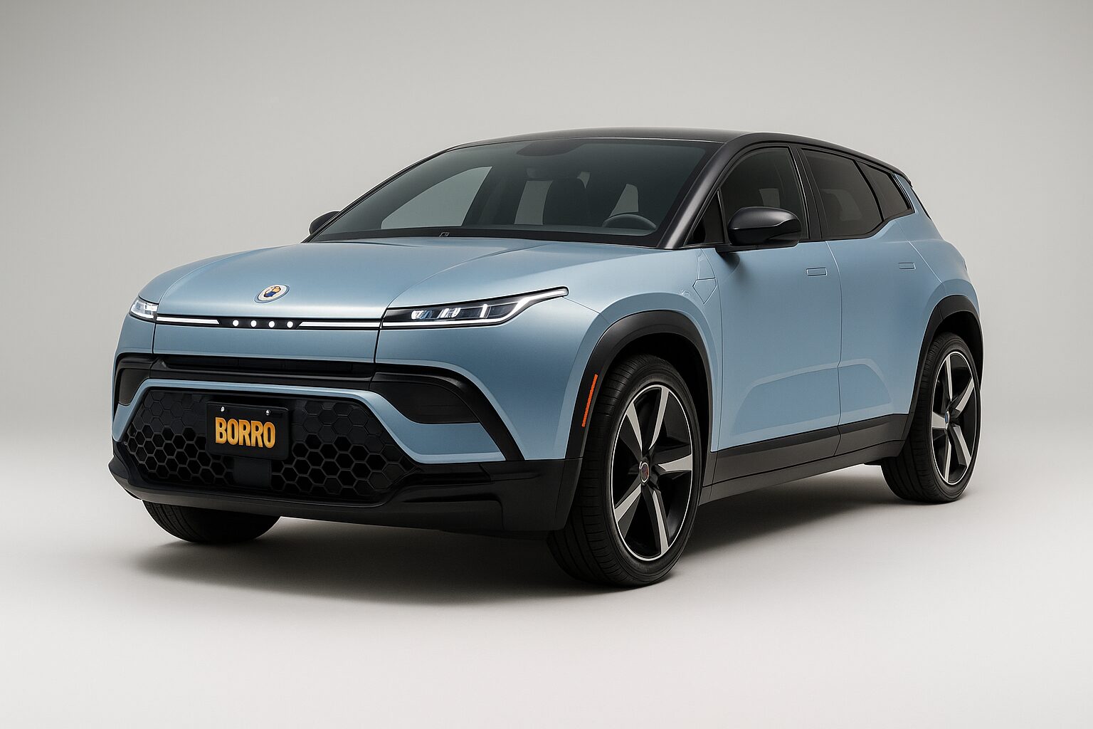 A light blue Fisker Ocean Ultra electric SUV with a BORRO plate, photographed at a three-quarter angle in studio lighting on a smooth gray backdrop.